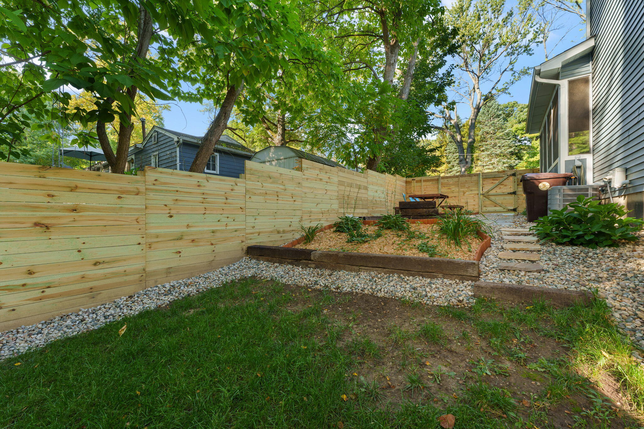 4200 Cardinal Lane Valparaiso, IN 46383 - Photo 35 of 44 a view of a backyard with a garden