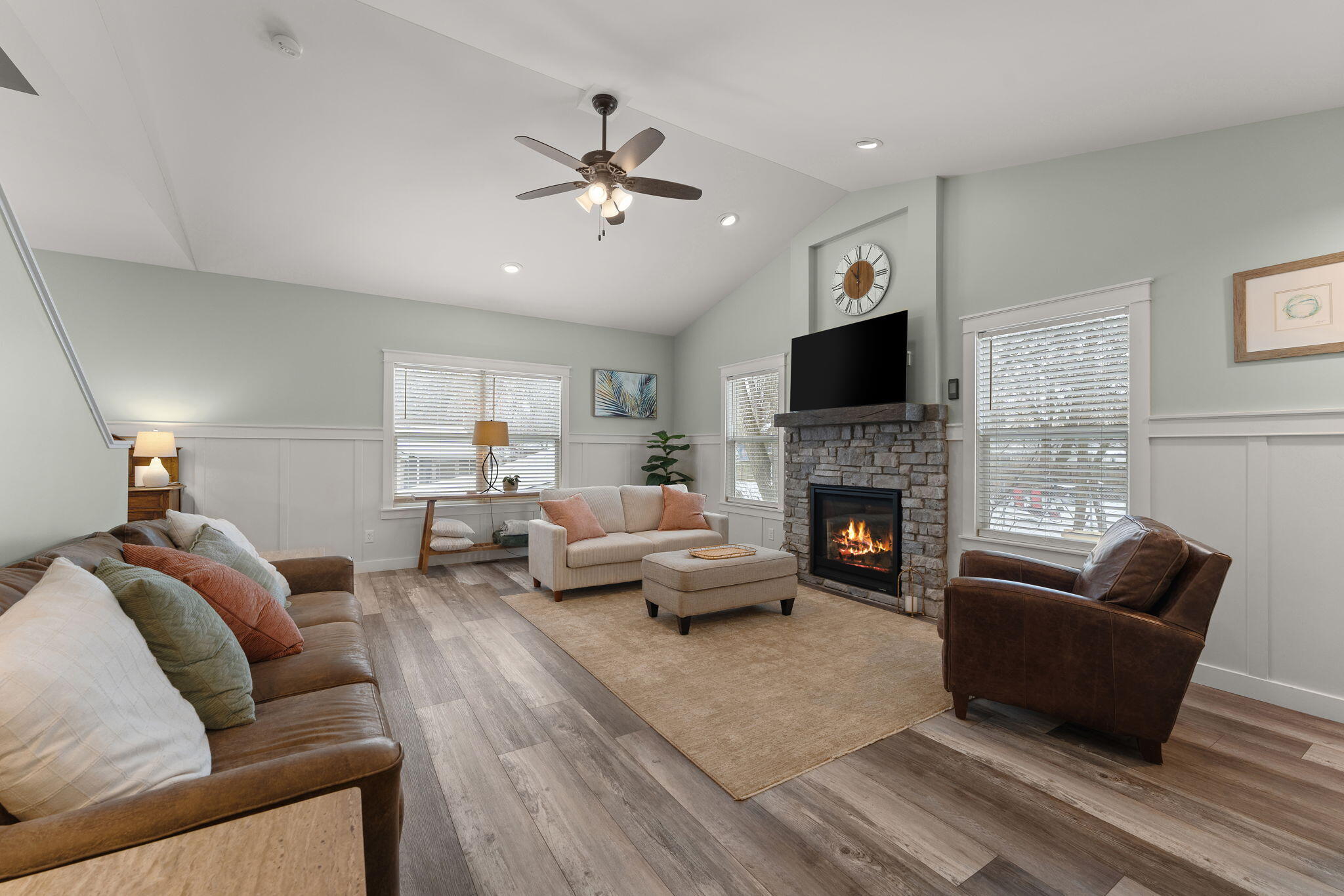 4200 Cardinal Lane Valparaiso, IN 46383 - Photo 7 of 44 a living room with furniture a fireplace and a flat screen tv