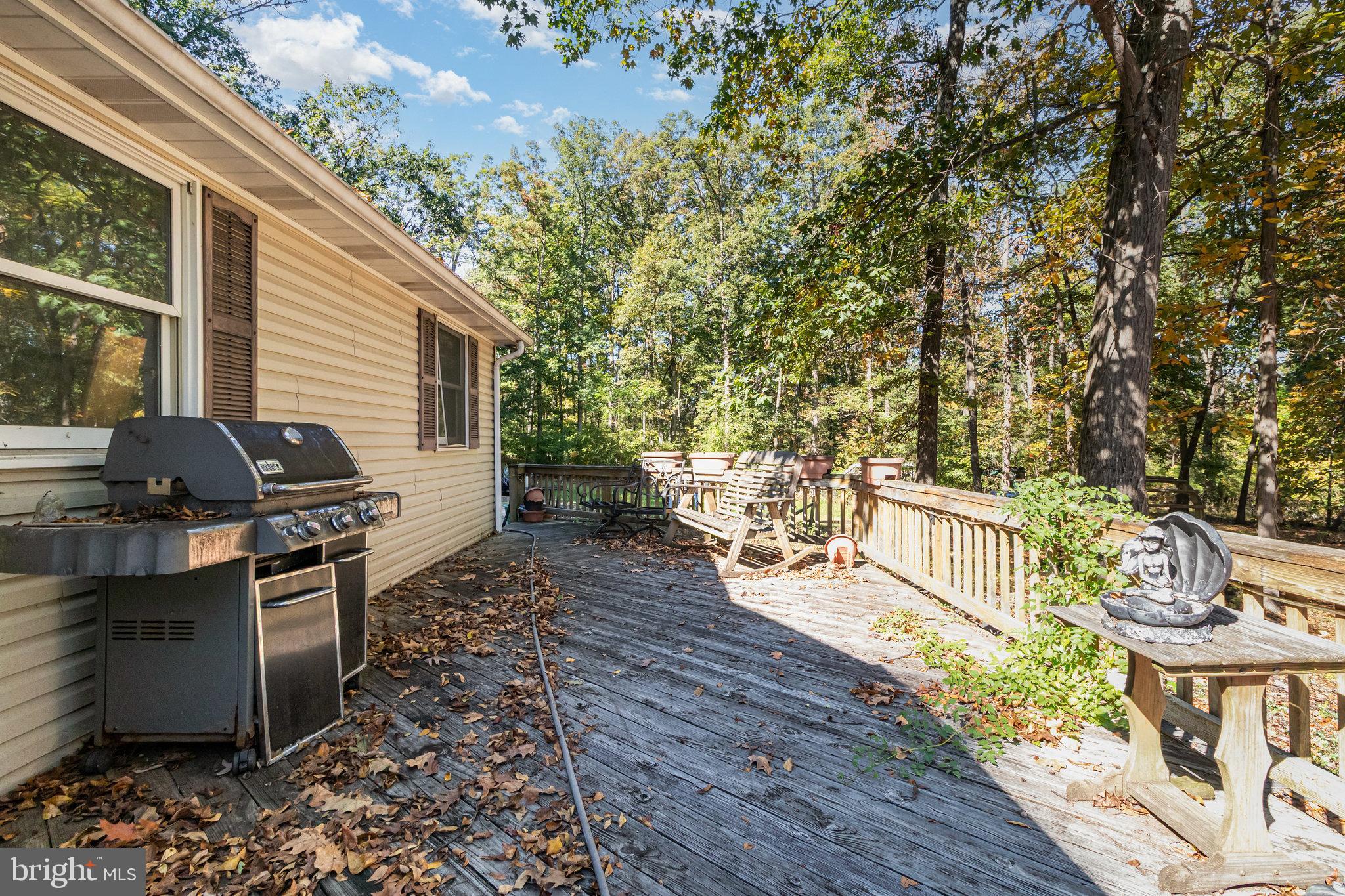 474 Ridge Road Gettysburg, PA 17325 - Photo 6 of 23 a view of a patio with table and chairs and wooden floor