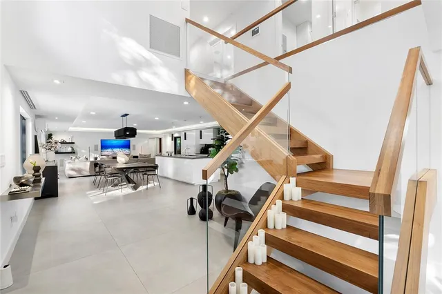 a spacious bedroom with a bed and a large window