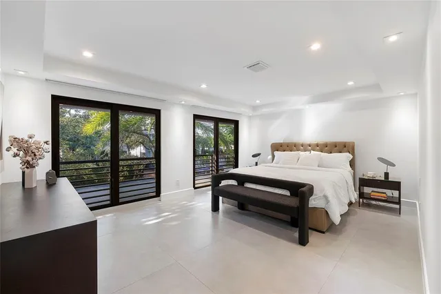 a bathroom with a double vanity sink a mirror and a shower