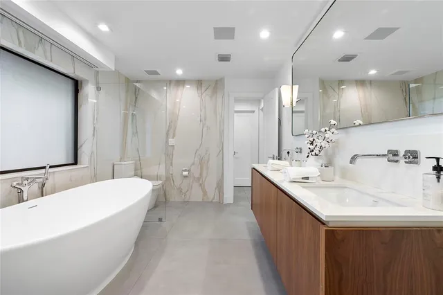 a white bath tub sitting in a bathroom