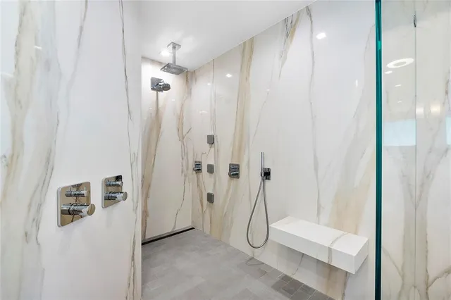 a room with two chair and a lamp on a dresser