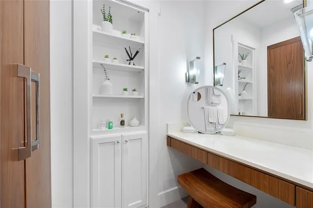 a bathroom with a sink and mirror
