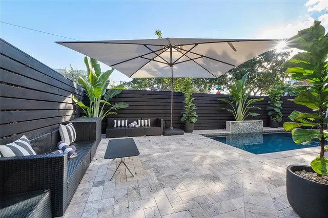 a outdoor dining space with furniture and outdoor view