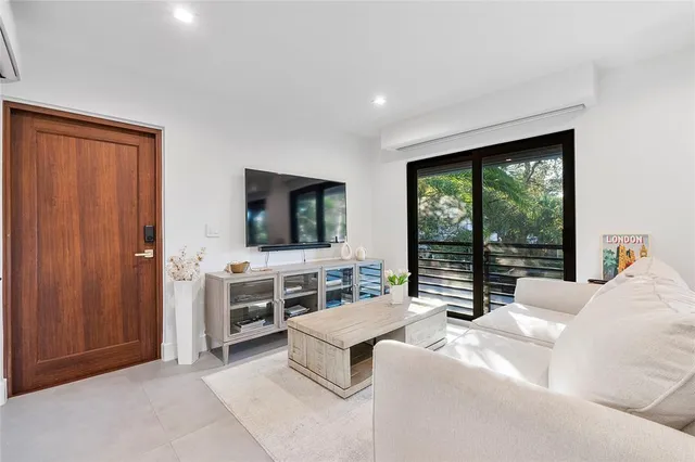 a view of a chair and table in the patio