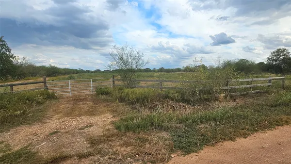 a view of a lake with a big yard