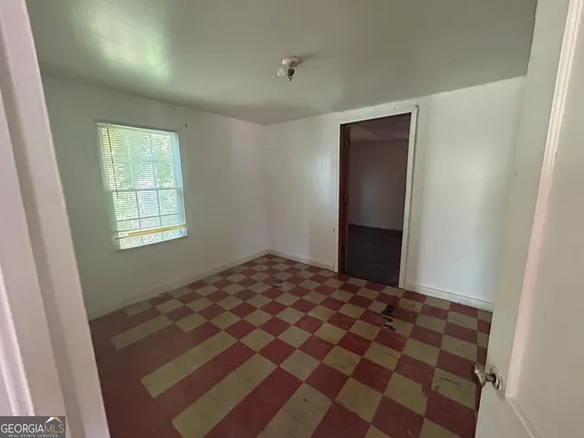 a view of a kitchen with a sink dishwasher and a fireplace