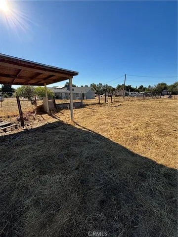 a view of swimming pool with lawn chairs