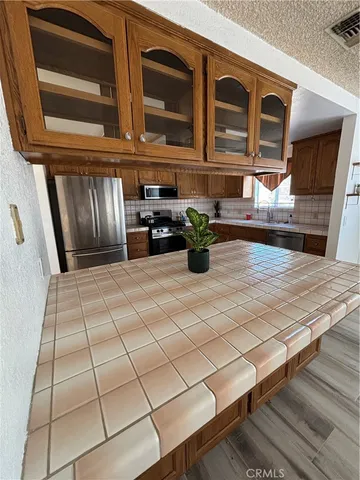 a view of an outdoor space kitchen