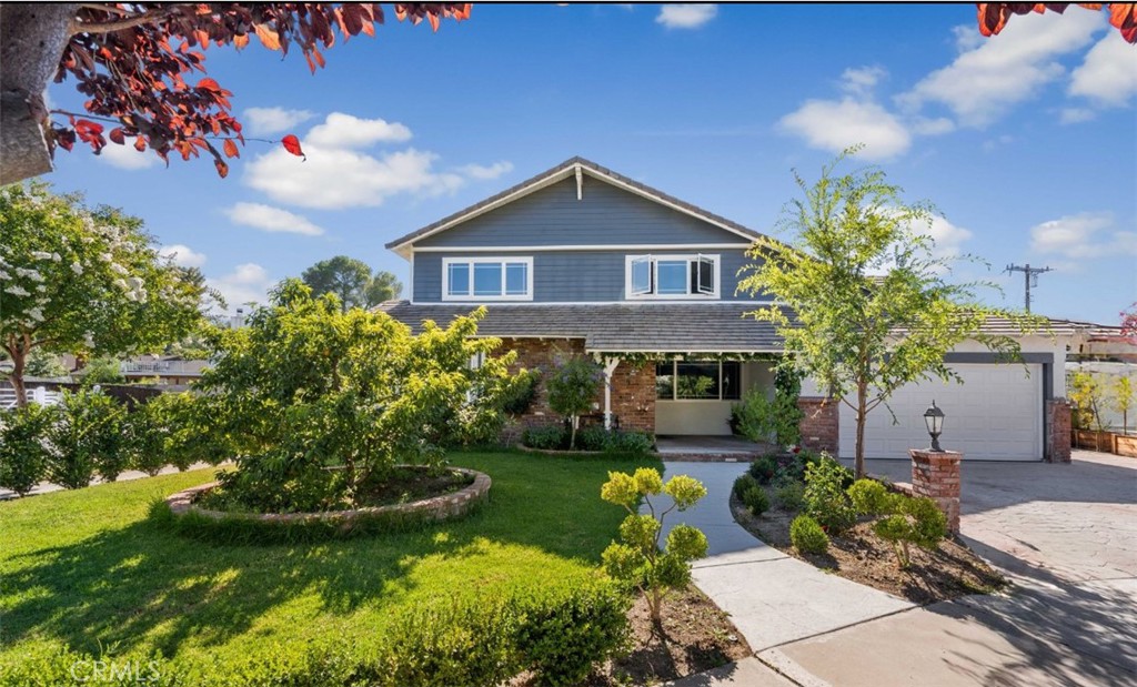 24405 Derian Drive Newhall, CA 91321 - Photo 1 of 44 a front view of a house with garden