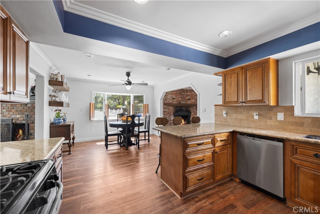 24405 Derian Drive Newhall, CA 91321 - Photo 11 of 44 a kitchen with a sink appliances and wooden floor