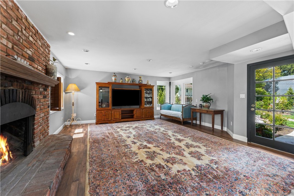 24405 Derian Drive Newhall, CA 91321 - Photo 15 of 44 a living room with furniture and a flat screen tv