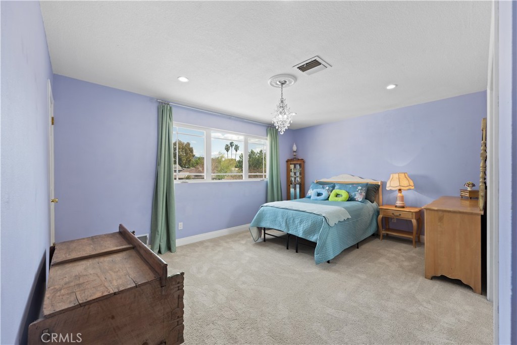 24405 Derian Drive Newhall, CA 91321 - Photo 20 of 44 a bedroom with a bed and window