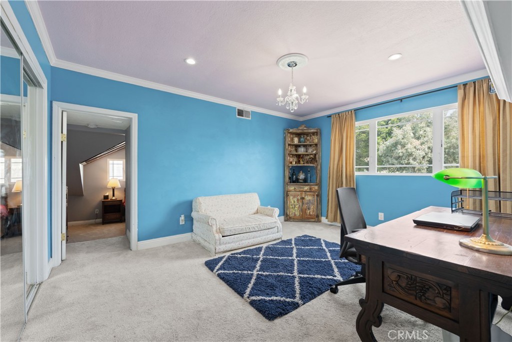 24405 Derian Drive Newhall, CA 91321 - Photo 22 of 44 a living room with furniture a large window and table
