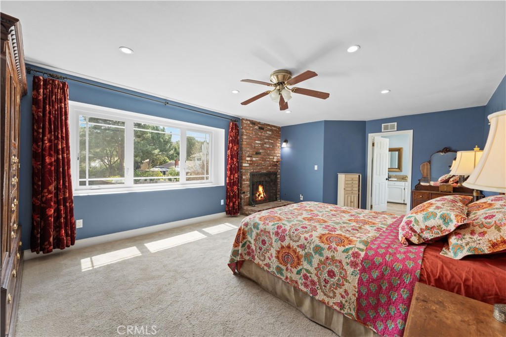 24405 Derian Drive Newhall, CA 91321 - Photo 27 of 44 a bedroom with a large bed and a window