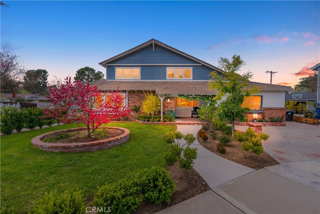 24405 Derian Drive Newhall, CA 91321 - Photo 3 of 44 a front view of a house with a yard