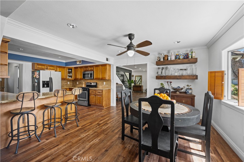 24405 Derian Drive Newhall, CA 91321 - Photo 9 of 44 a view of a dining room with furniture and wooden floor