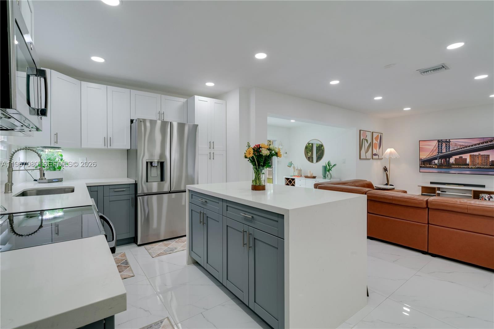 1401 Southwest 94th Avenue Miami, FL 33174 - Photo 12 of 27 a kitchen with stainless steel appliances a refrigerator sink and wooden cabinets