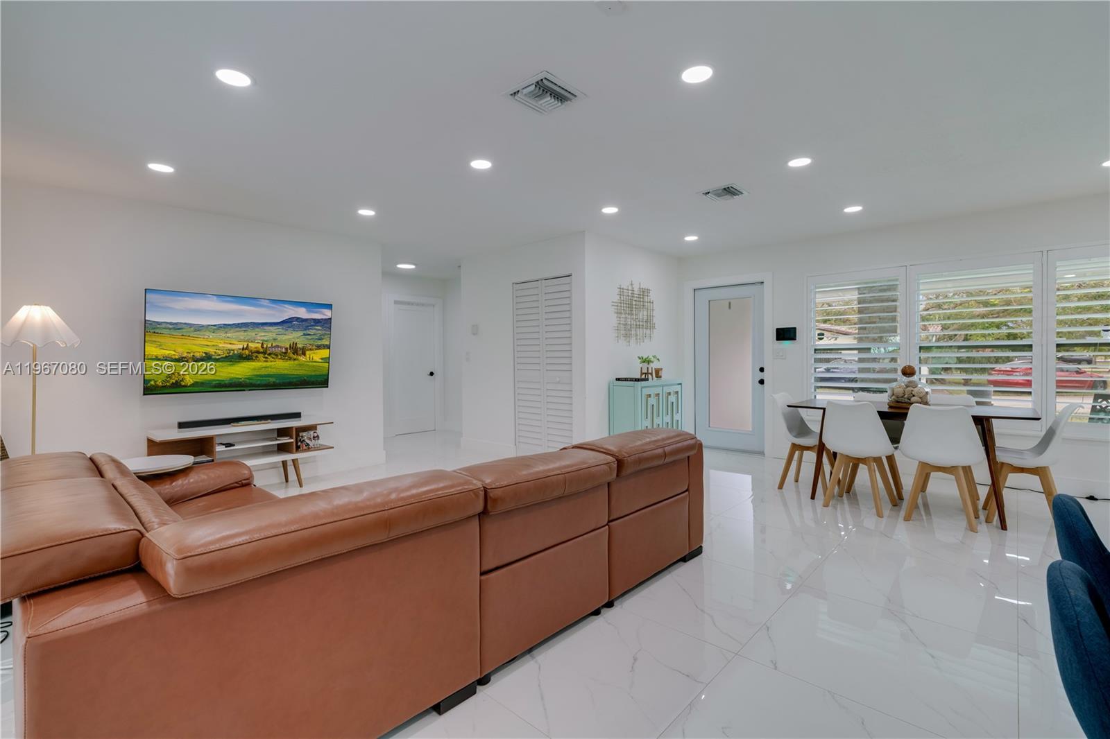 1401 Southwest 94th Avenue Miami, FL 33174 - Photo 13 of 27 a living room with furniture and a flat screen tv