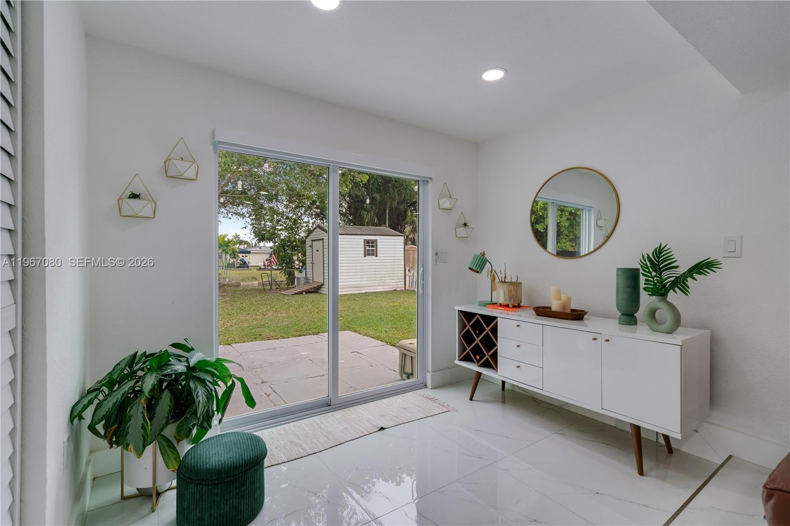 1401 Southwest 94th Avenue Miami, FL 33174 - Photo 14 of 27 a living room with furniture and a potted plant