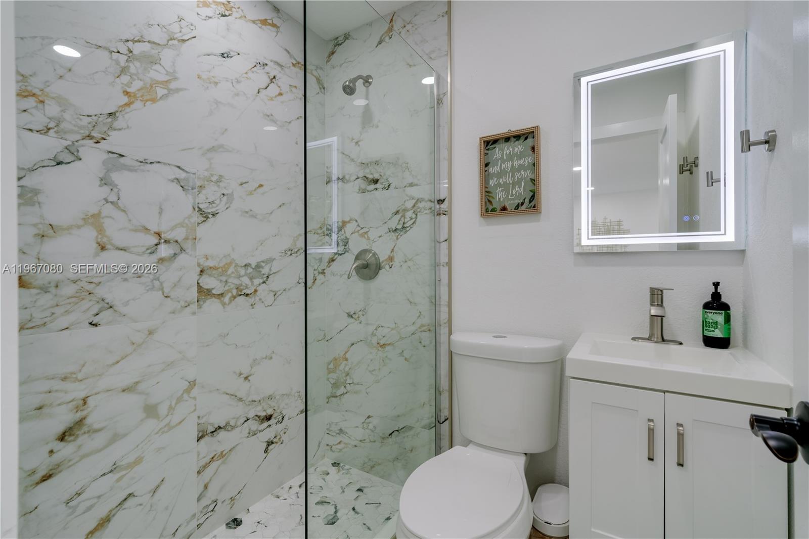 1401 Southwest 94th Avenue Miami, FL 33174 - Photo 16 of 27 a bathroom with a toilet sink and shower