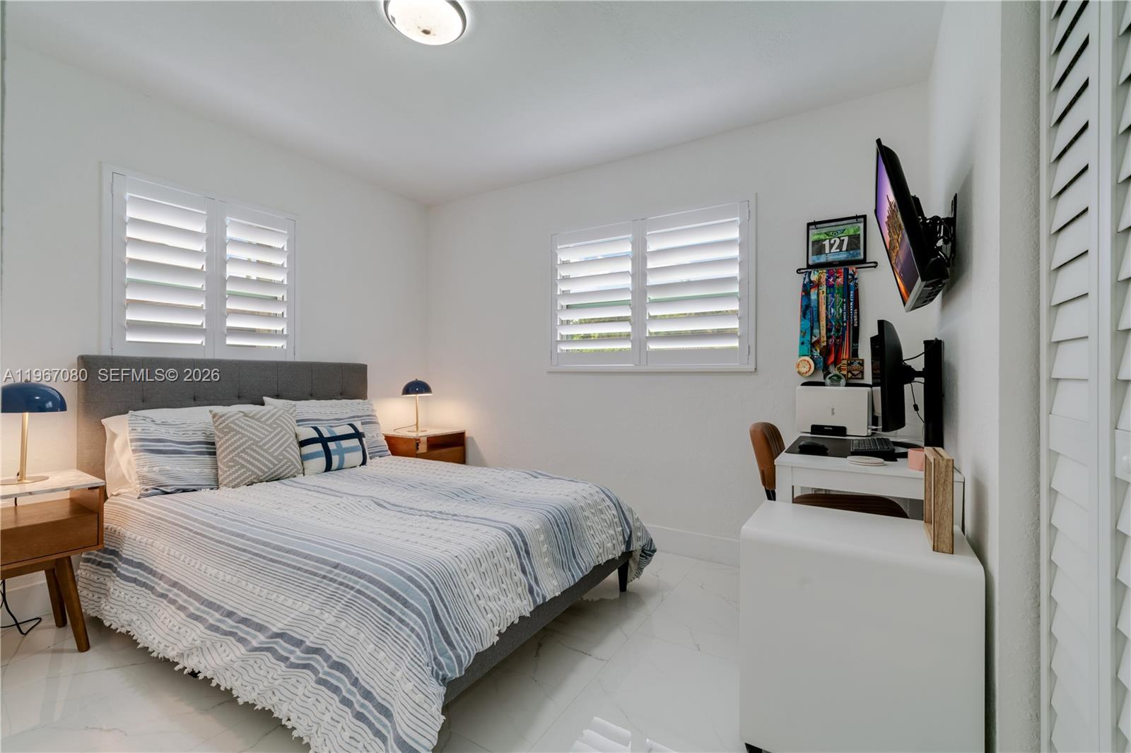 1401 Southwest 94th Avenue Miami, FL 33174 - Photo 20 of 27 a bedroom with a bed and a window
