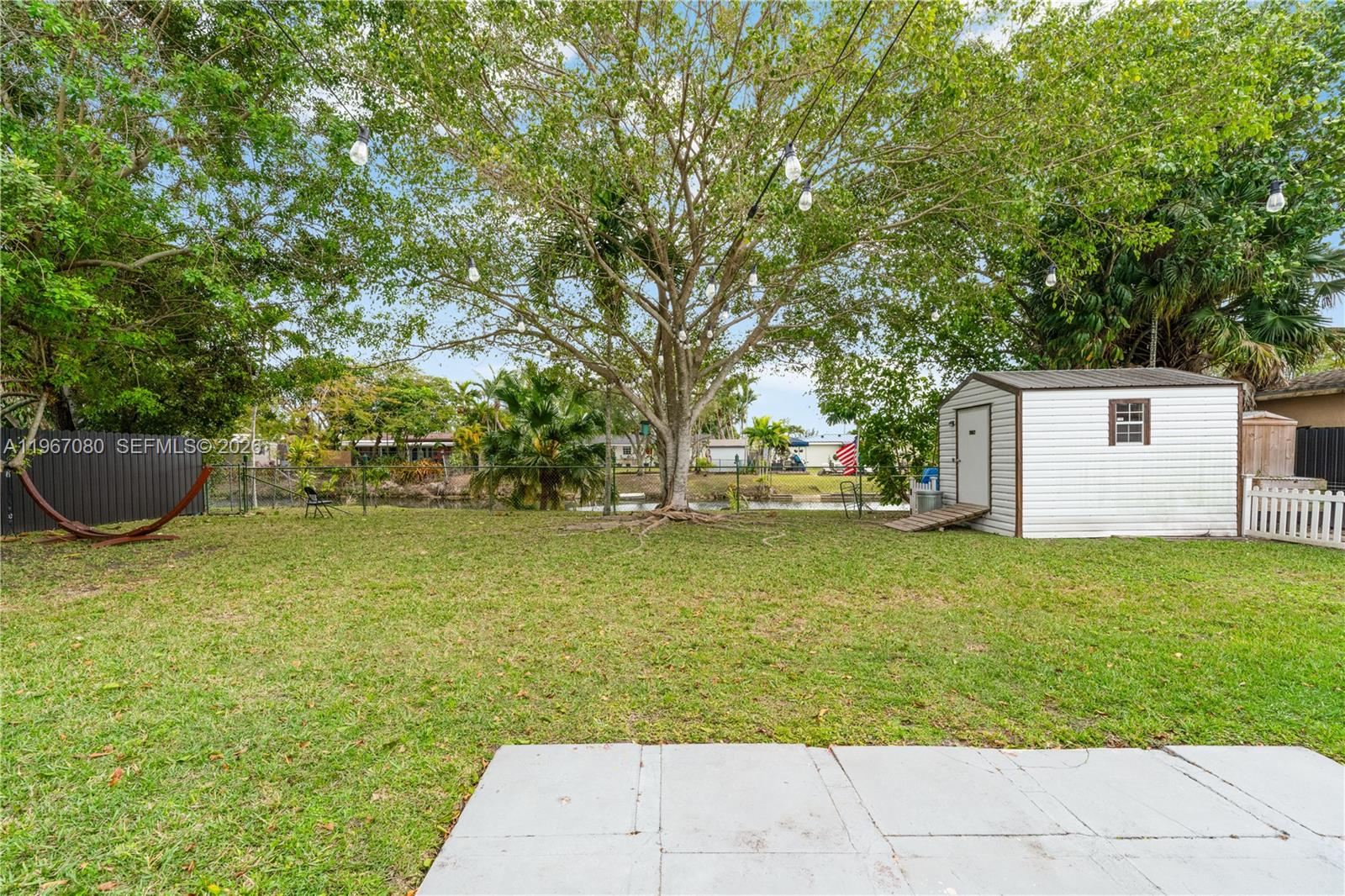 1401 Southwest 94th Avenue Miami, FL 33174 - Photo 25 of 27 a view of a backyard with large trees
