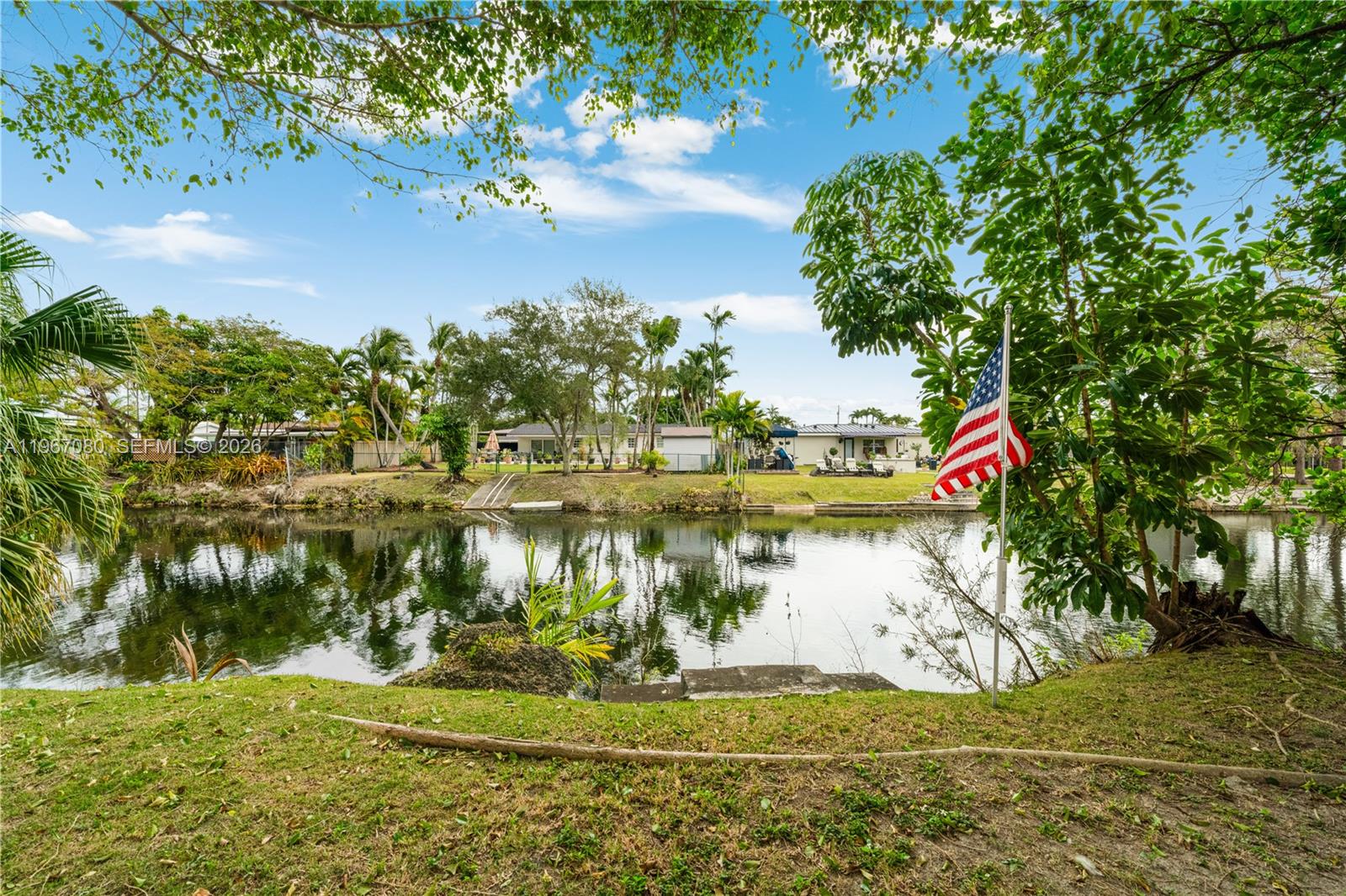 1401 Southwest 94th Avenue Miami, FL 33174 - Photo 27 of 27 a view of a lake with a yard