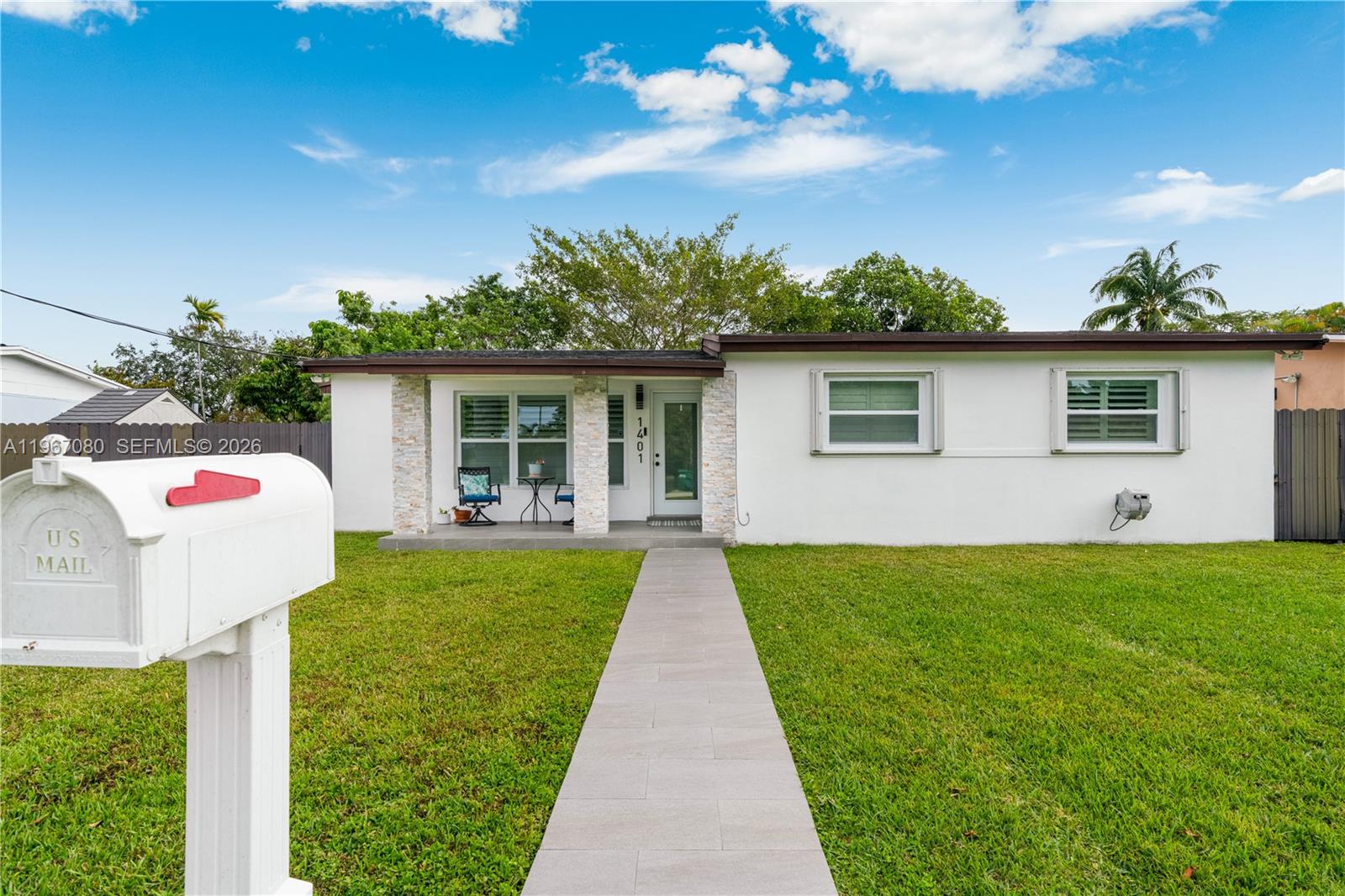 1401 Southwest 94th Avenue Miami, FL 33174 - Photo 3 of 27 a front view of house with yard and green space