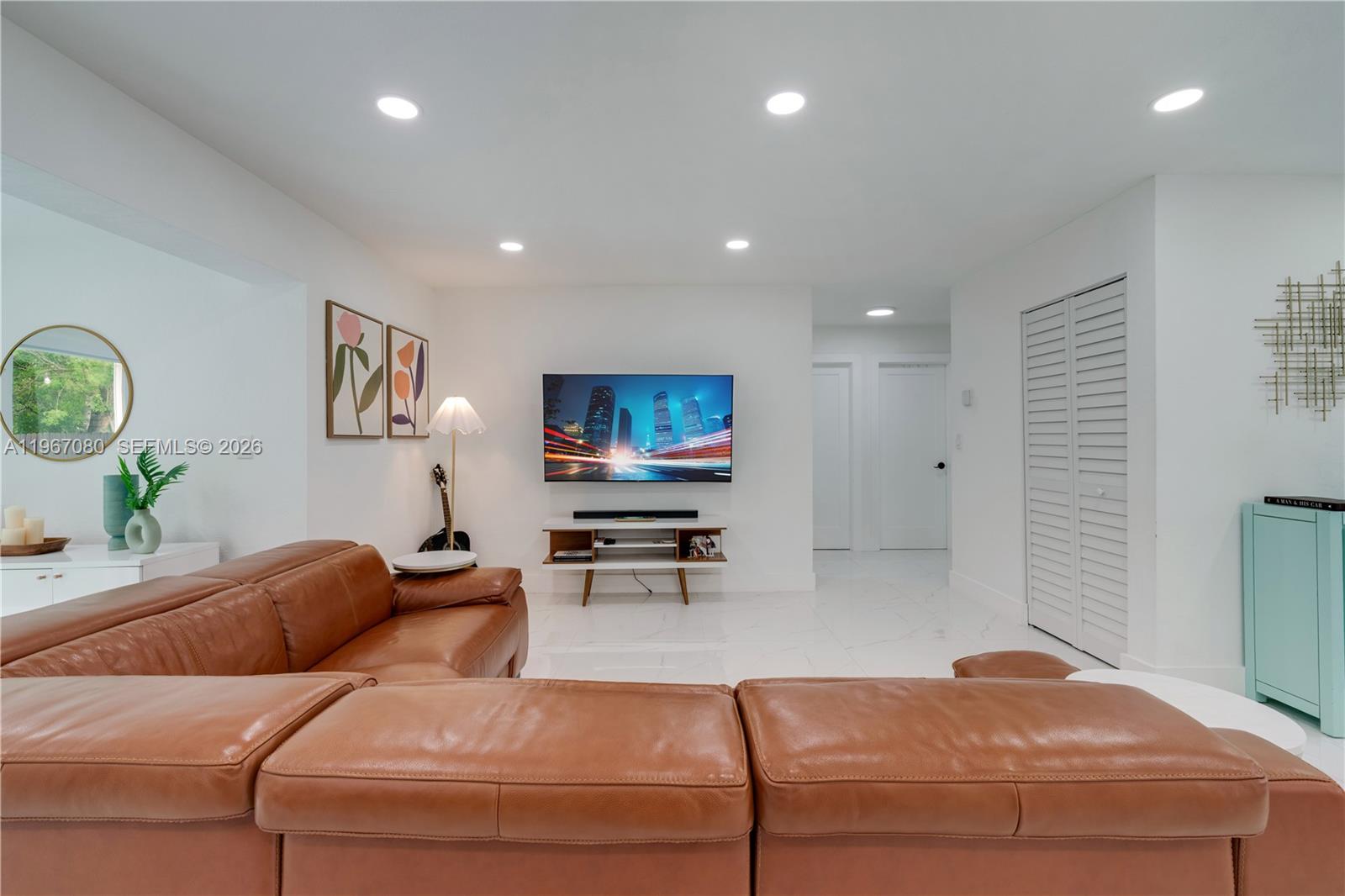 1401 Southwest 94th Avenue Miami, FL 33174 - Photo 9 of 27 a living room with furniture and a flat screen tv