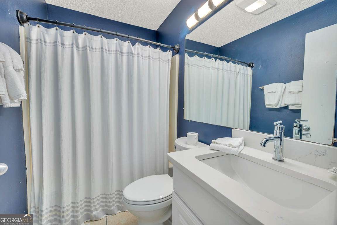 143 South Island Square Drive St. Simons, GA 31522 - Photo 14 of 26 a bathroom with a sink toilet and shower