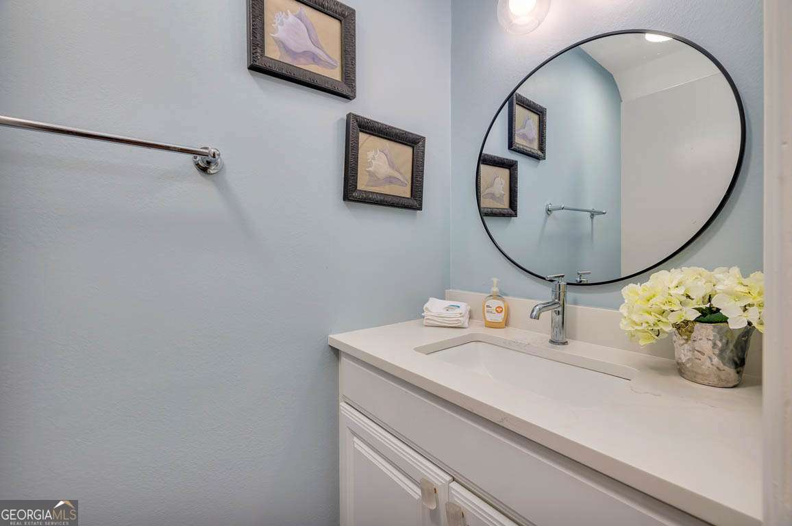 143 South Island Square Drive St. Simons, GA 31522 - Photo 15 of 26 a bathroom with a sink and a mirror