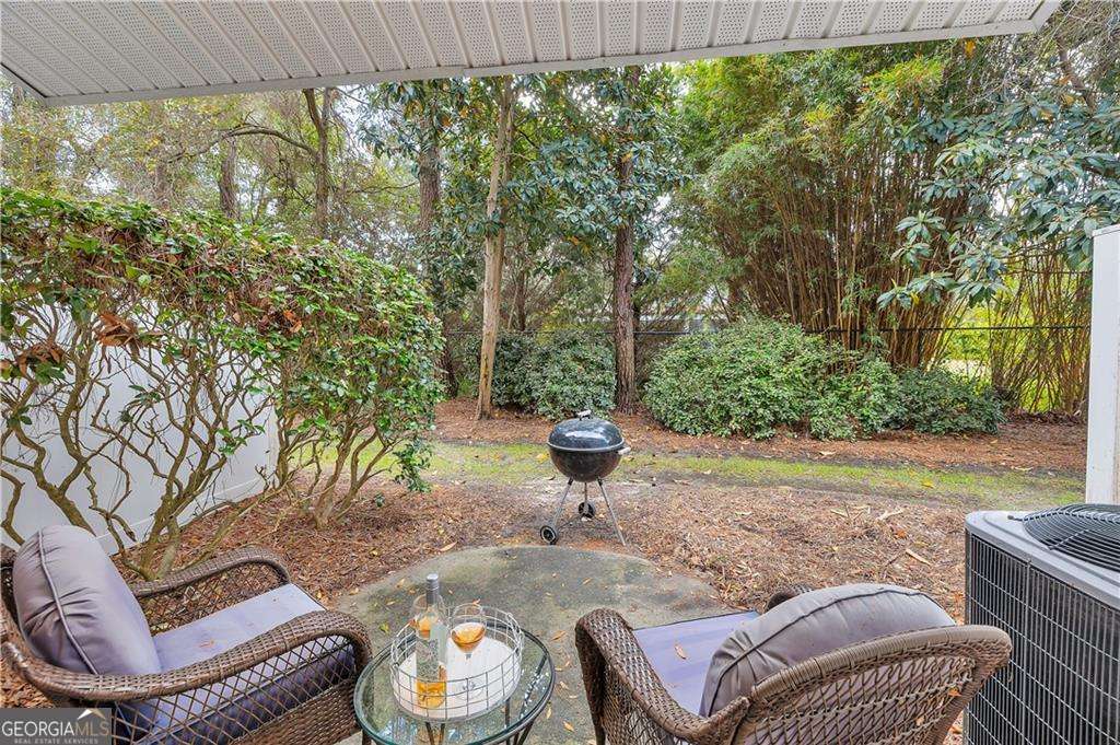 143 South Island Square Drive St. Simons, GA 31522 - Photo 21 of 26 a outdoor sitting area with furniture and a garden