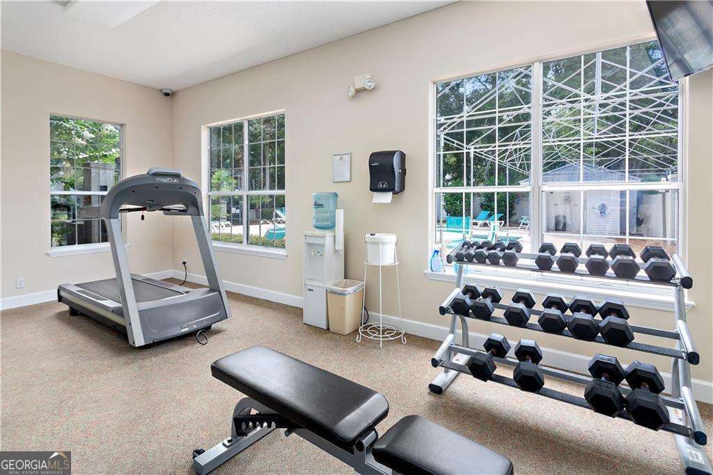 143 South Island Square Drive St. Simons, GA 31522 - Photo 24 of 26 a room with gym equipment and a large window