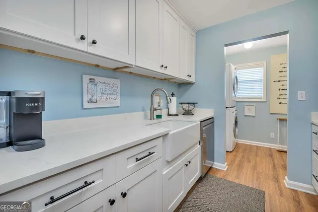 a kitchen with cabinets and window