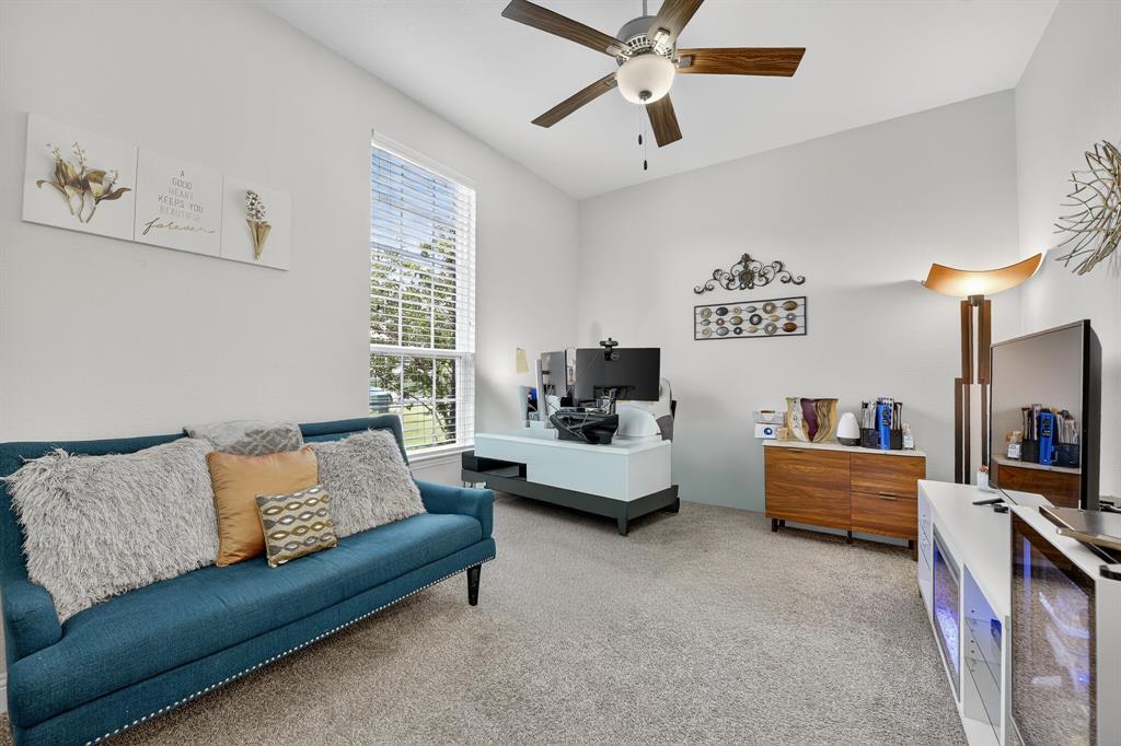 1420 Wolf Ridge Run Gunter, TX 75058 - Photo 16 of 40 a living room with furniture and flat screen tv