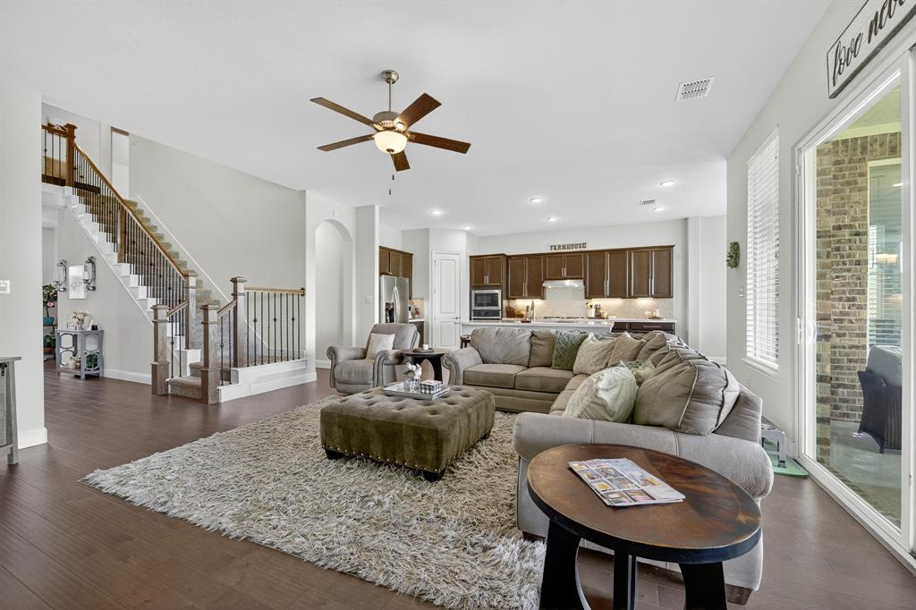 1420 Wolf Ridge Run Gunter, TX 75058 - Photo 20 of 40 a living room with furniture and a large window