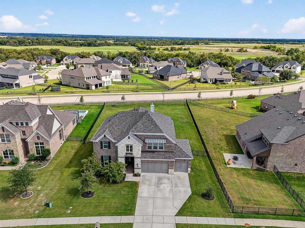 1420 Wolf Ridge Run Gunter, TX 75058 - Photo 2 of 40 an aerial view of a house with a ocean view