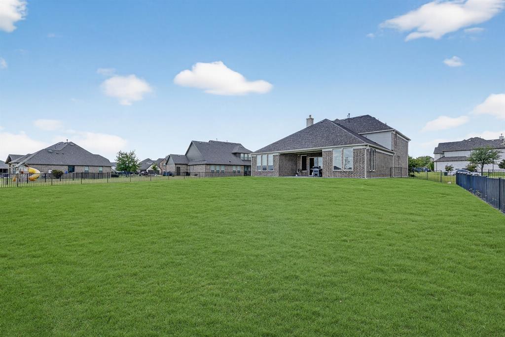1420 Wolf Ridge Run Gunter, TX 75058 - Photo 23 of 40 a view of a house with a yard