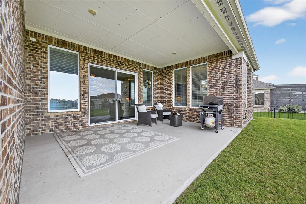 1420 Wolf Ridge Run Gunter, TX 75058 - Photo 25 of 40 a view of an house with backyard porch and sitting area
