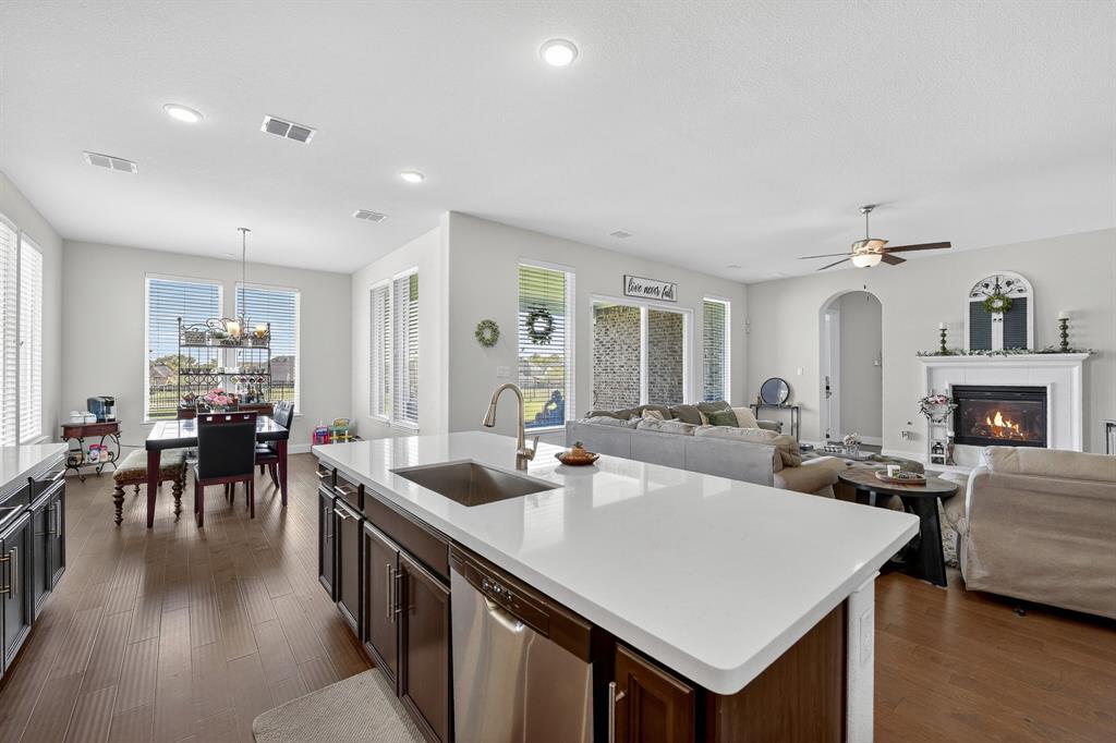 1420 Wolf Ridge Run Gunter, TX 75058 - Photo 30 of 40 a view of a dining room with furniture and wooden floor