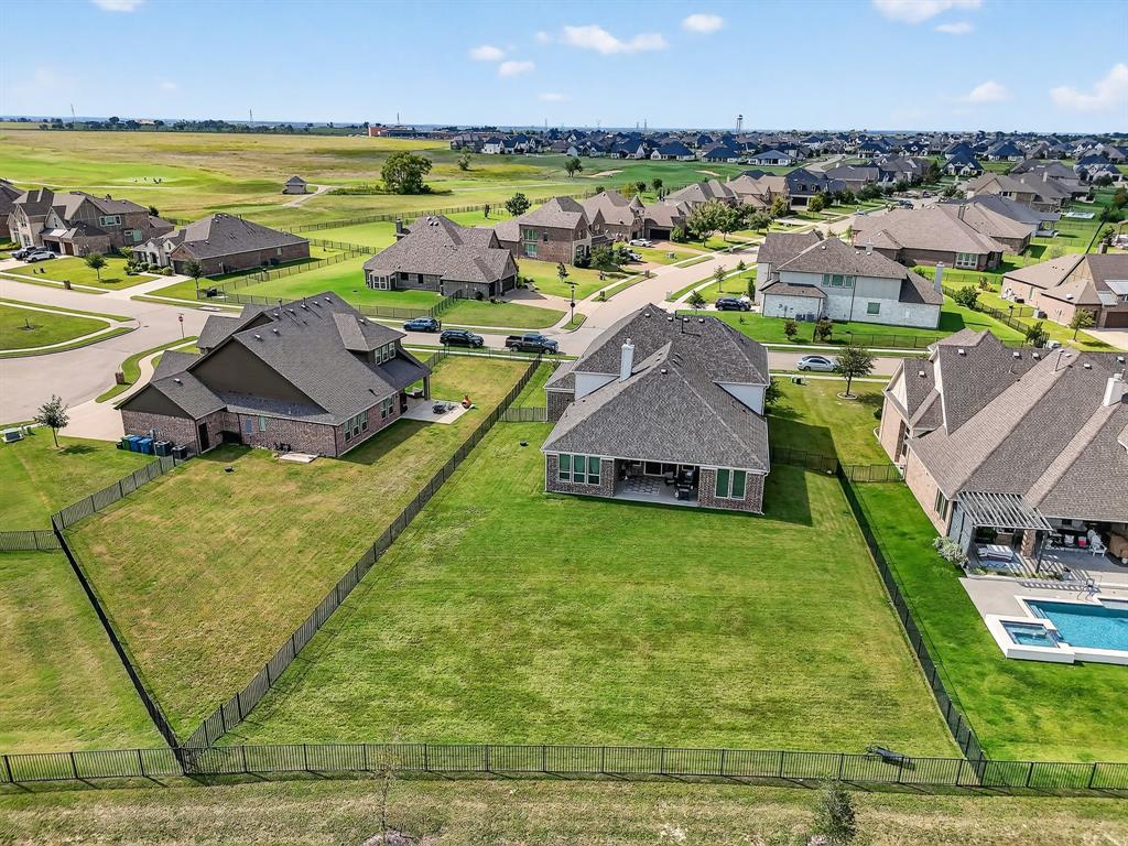1420 Wolf Ridge Run Gunter, TX 75058 - Photo 3 of 40 an aerial view of residential houses with outdoor space and swimming pool