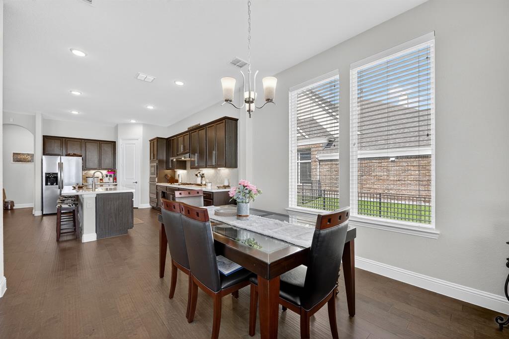 1420 Wolf Ridge Run Gunter, TX 75058 - Photo 32 of 40 a view of a dining room with furniture window and wooden floor