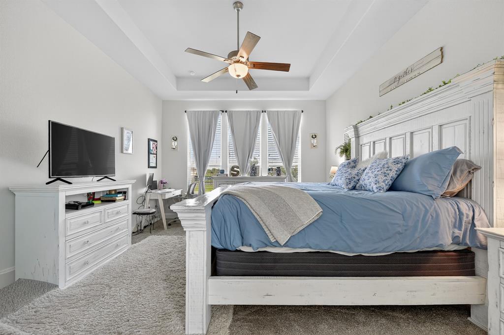 1420 Wolf Ridge Run Gunter, TX 75058 - Photo 37 of 40 a living room with furniture and a flat screen tv