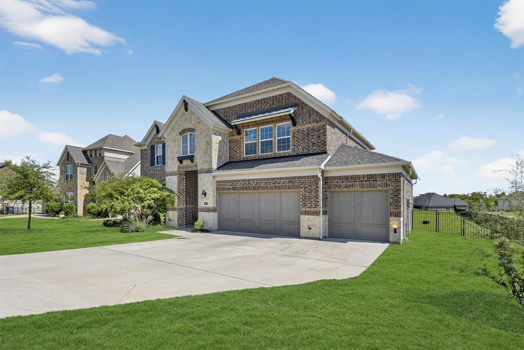 1420 Wolf Ridge Run Gunter, TX 75058 - Photo 6 of 40 a front view of a house with a garden