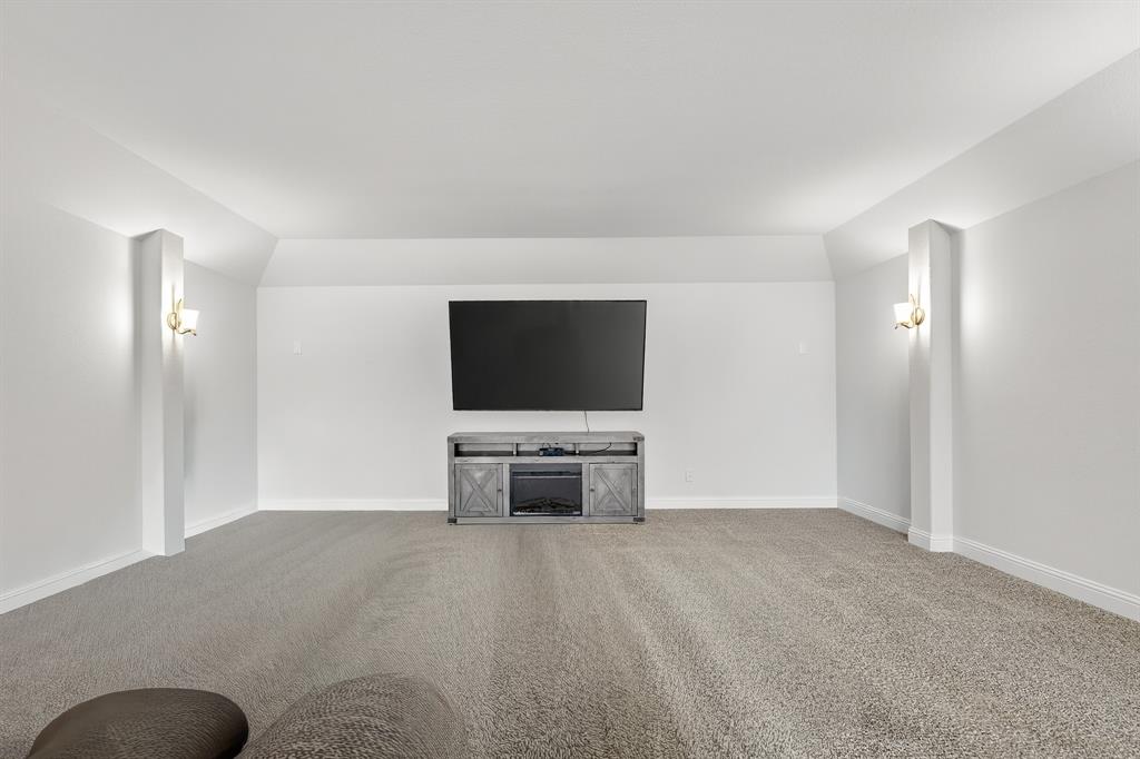 1420 Wolf Ridge Run Gunter, TX 75058 - Photo 9 of 40 a living room with furniture and a flat screen tv