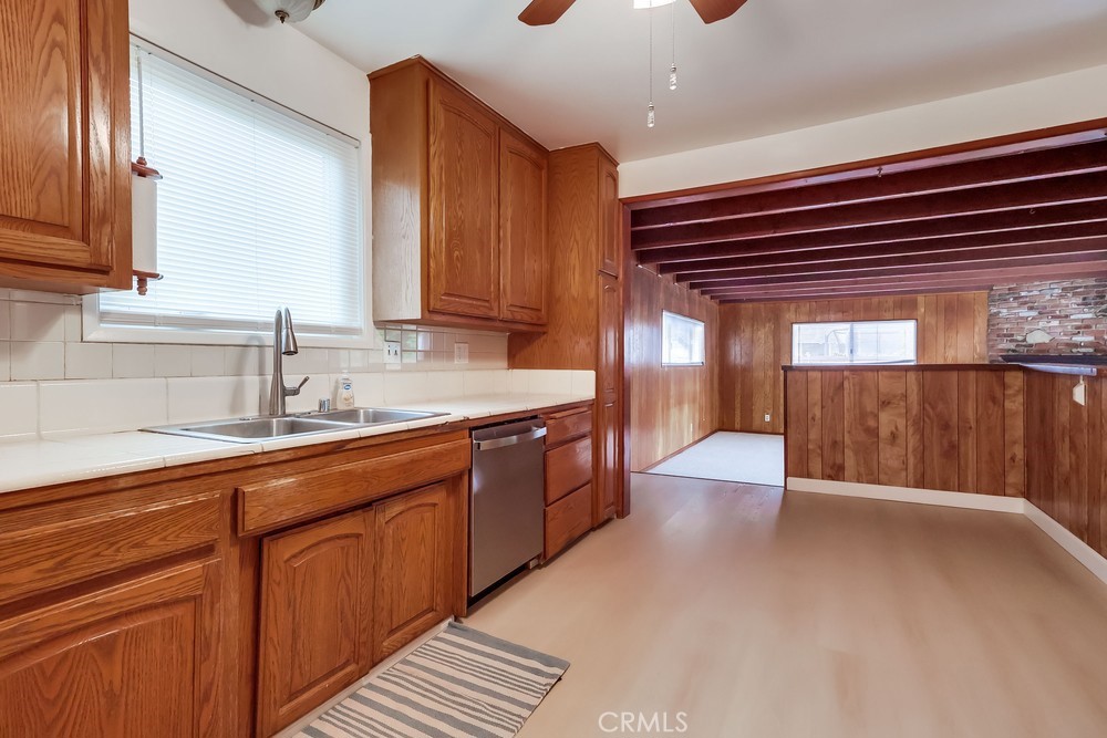 11639 Harvard Drive Norwalk, CA 90650 - Photo 14 of 33 a large kitchen with stainless steel appliances wooden cabinets a sink and a stove