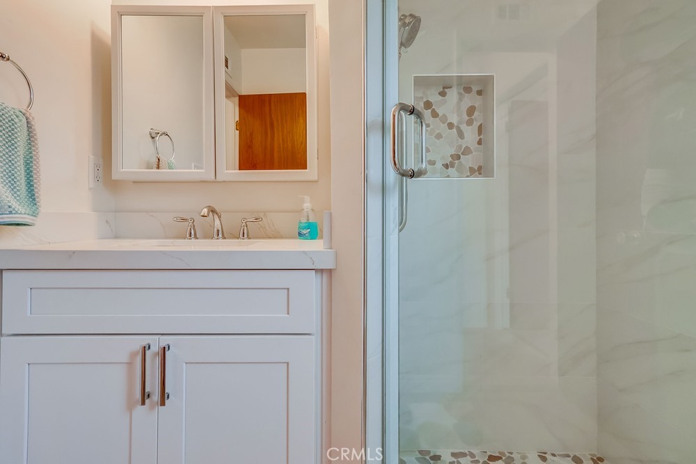 11639 Harvard Drive Norwalk, CA 90650 - Photo 17 of 33 a bathroom with a sink and a mirror