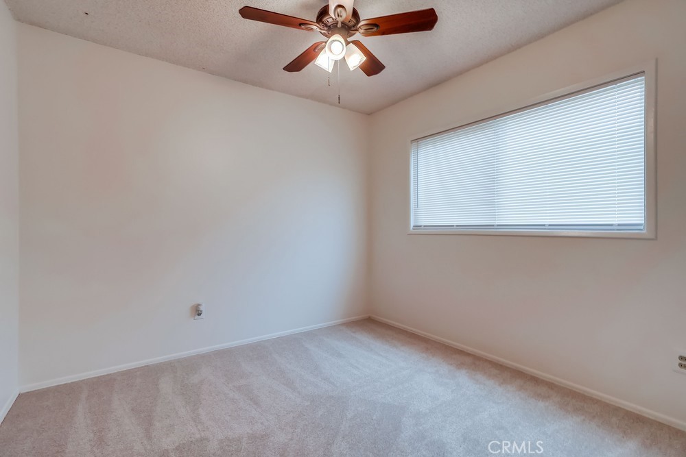 11639 Harvard Drive Norwalk, CA 90650 - Photo 18 of 33 an empty room with a window and a fan